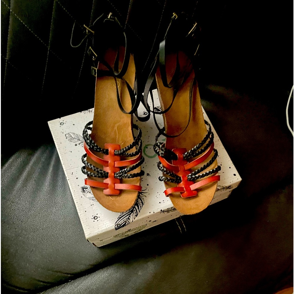 Coffee and black gladiator wedge sandal.